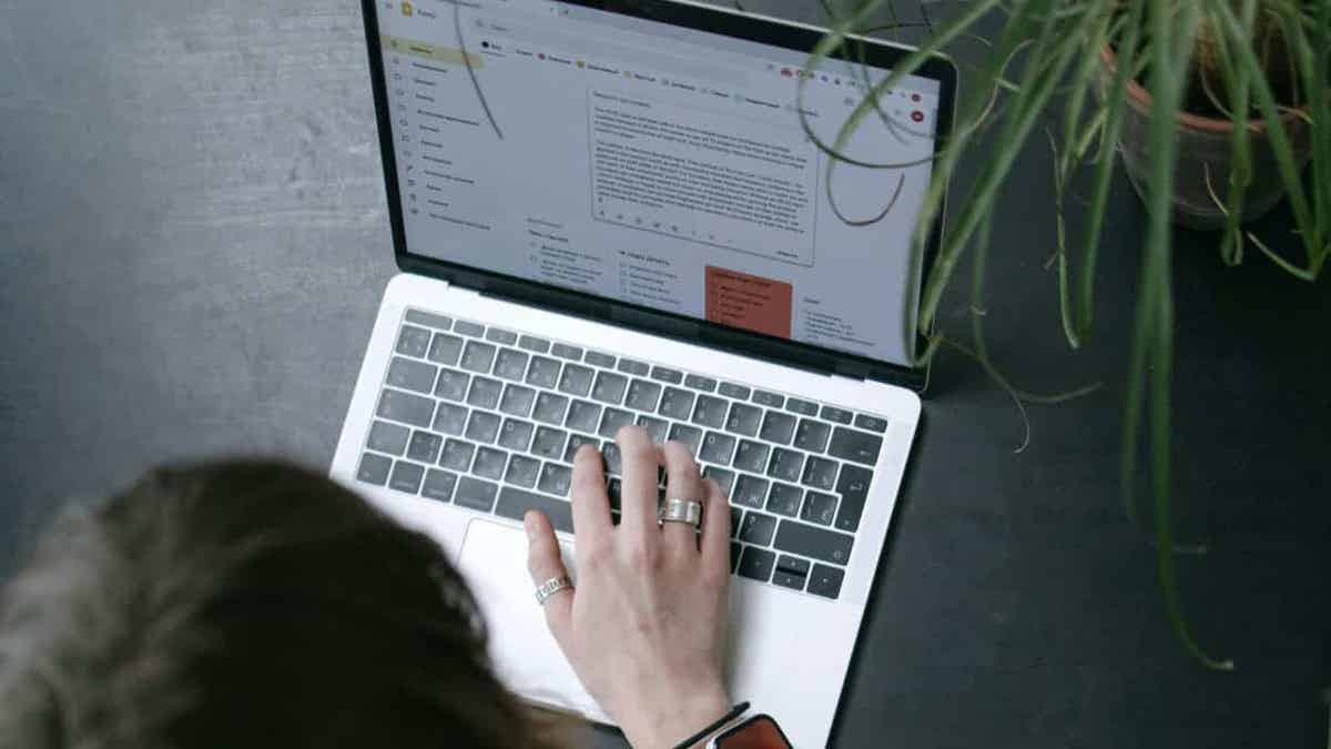A person checking emails on their laptop 