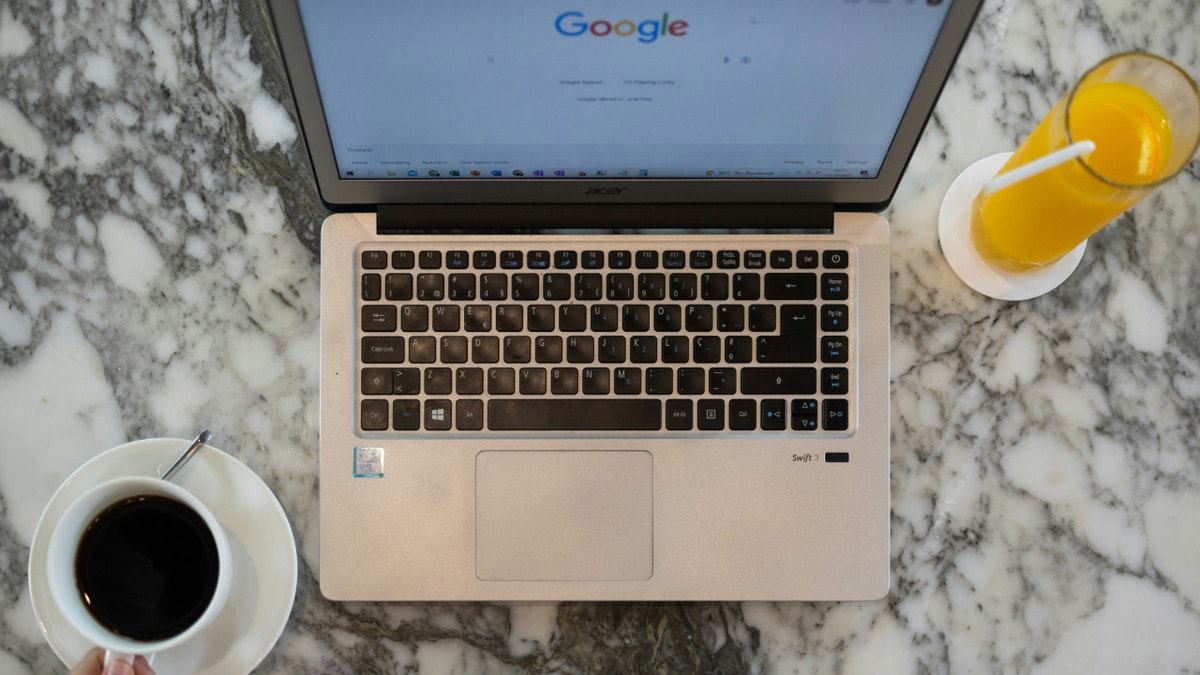 A laptop with the Google search screen on it