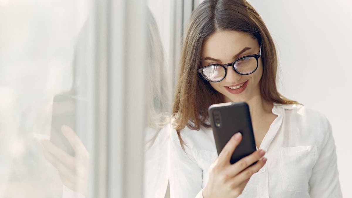 Woman smiles at her Android