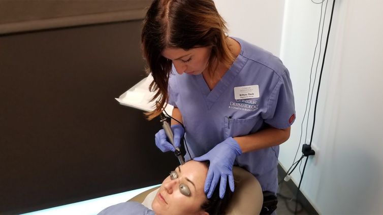Nurse Brittany Thiele uses a Dermapen to rejuvenate a patient