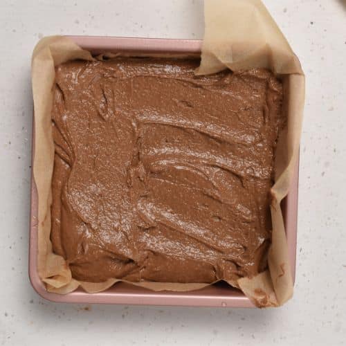 Flourless Protein Cake batter in a square pan ready to bake.