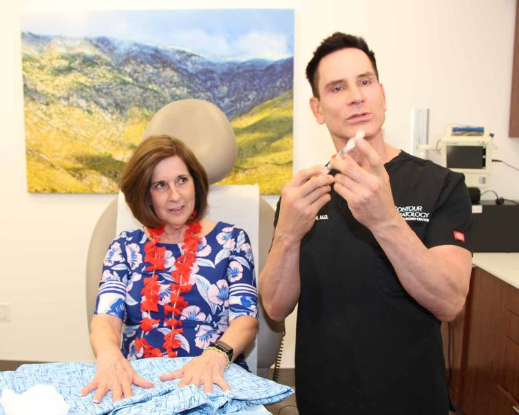 Dr. Jochen administering filler for hands at Day of Beauty.