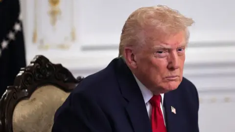 Reuters US President Donald Trump looks on as he participates in a call with service members of the US Army