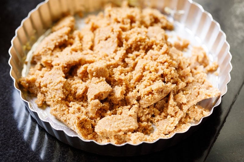 Crumbled biscuit crust on pie pan.
