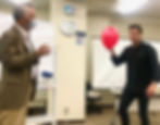Melbourne Magician Richard Vegas holds a balloon during a magic performance in his magic lecture at the TAMC in Tokyo, Japan.