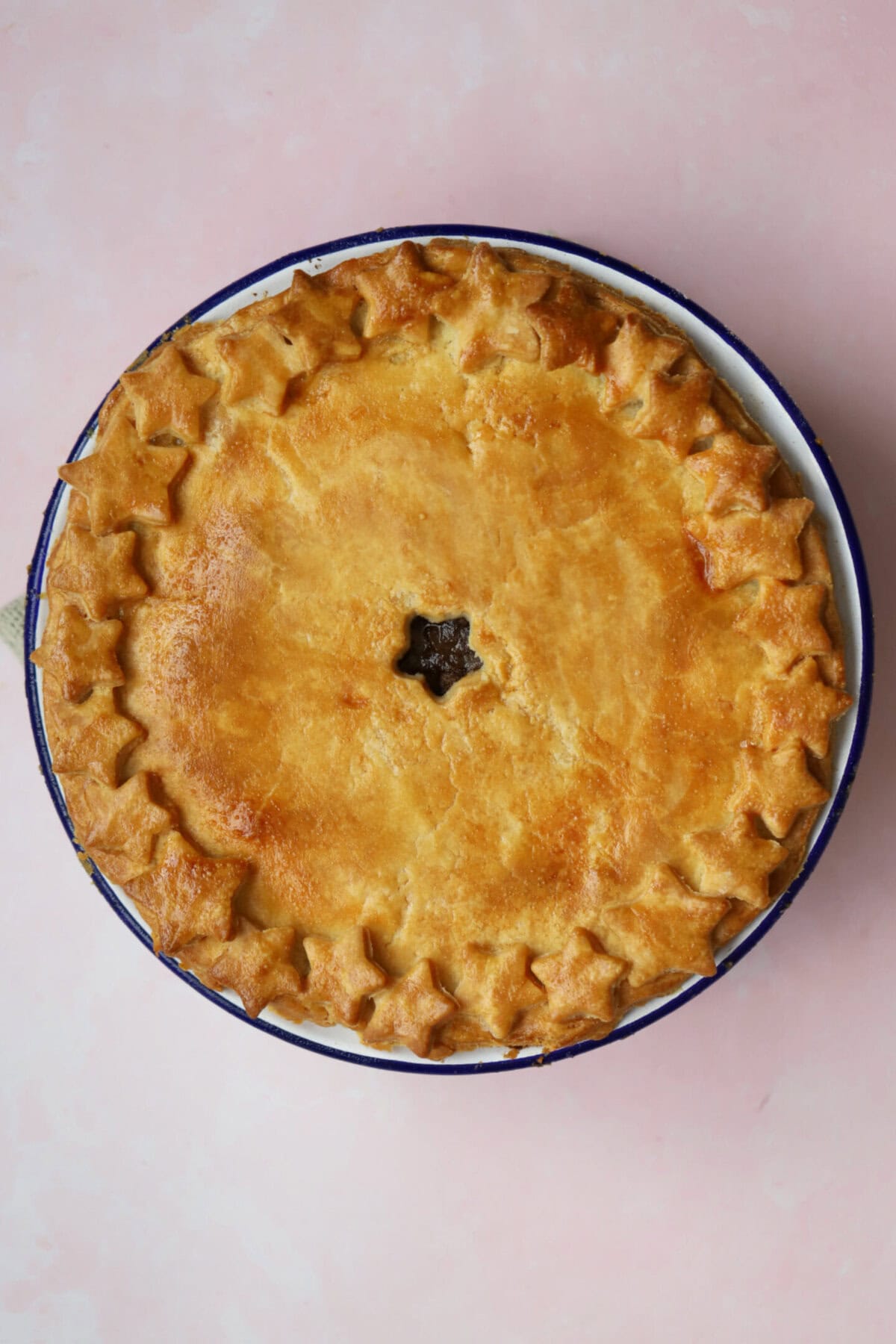 Process shot of a minced beef pie showing the finished, baked pie.