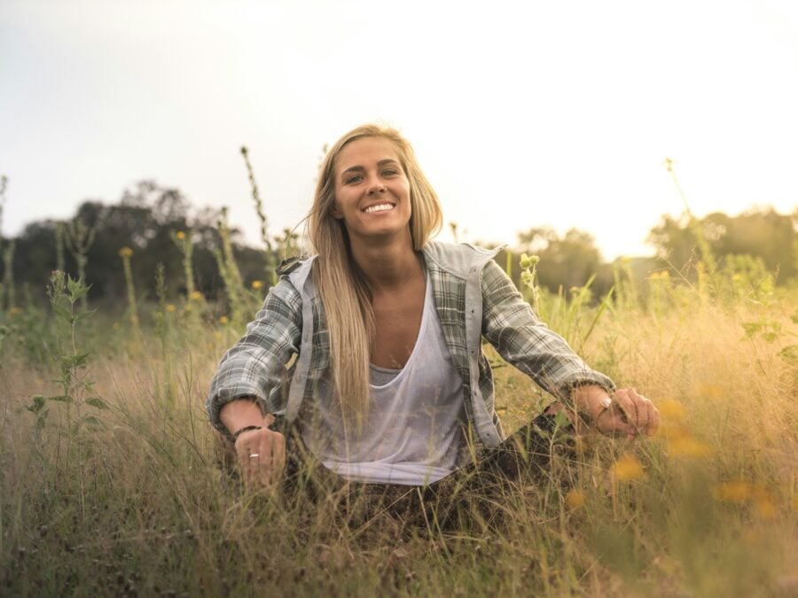woman sitting in fields