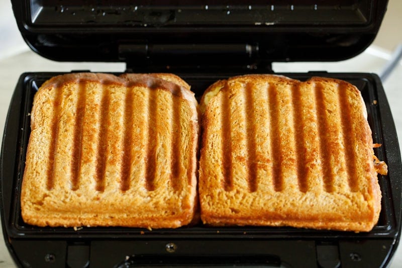 grilled vegetable sandwiches inside the panini press.
