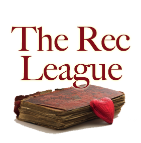 The Rec League - heart shaped chocolate resting on the edge of a very old book