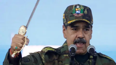 REUTERS/Leonardo Fernandez Viloria Venezuela's President Nicolas Maduro holds Simon Bolivar's sword as he addresses members of the armed forces