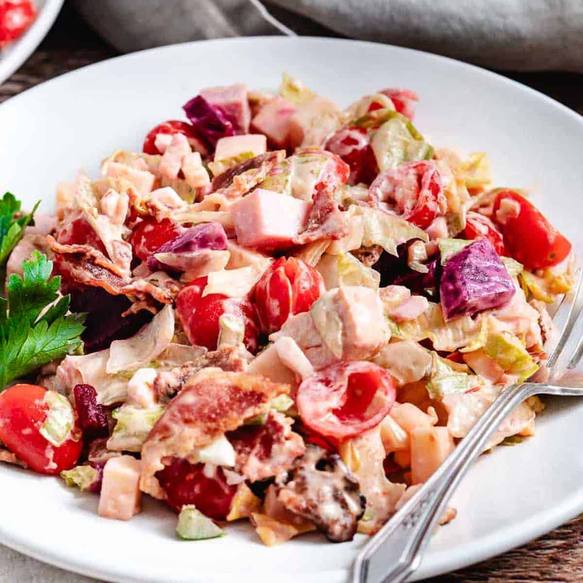 Gotham salad on white plate.