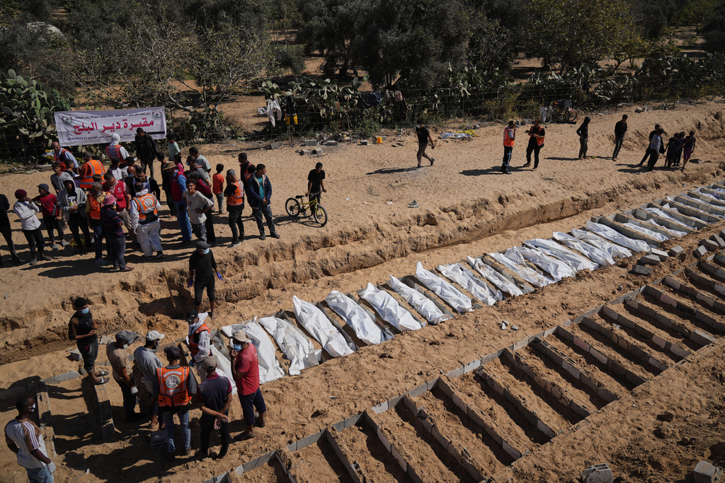 Bodies of unidentified Palestinians returned from Israel are buried in a mass grave in Deir al-Balah, Gaza Strip, in October 2025.
