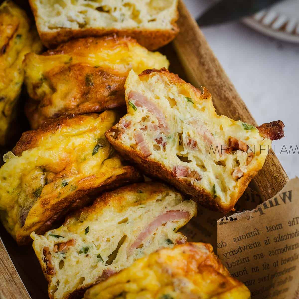 Bacon Egg and Cheese Muffins up really close with one cut in half.