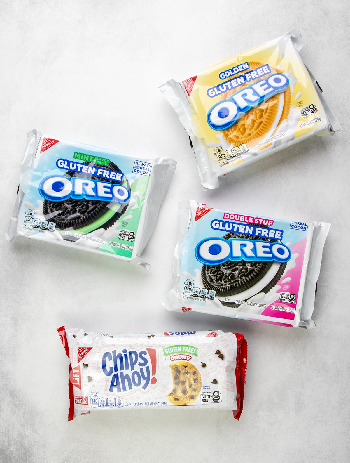 Packages of gluten free Mint Oreo, Golden Oreo, Double Stuf Oreo, and chewy Chips Ahoy cookies.