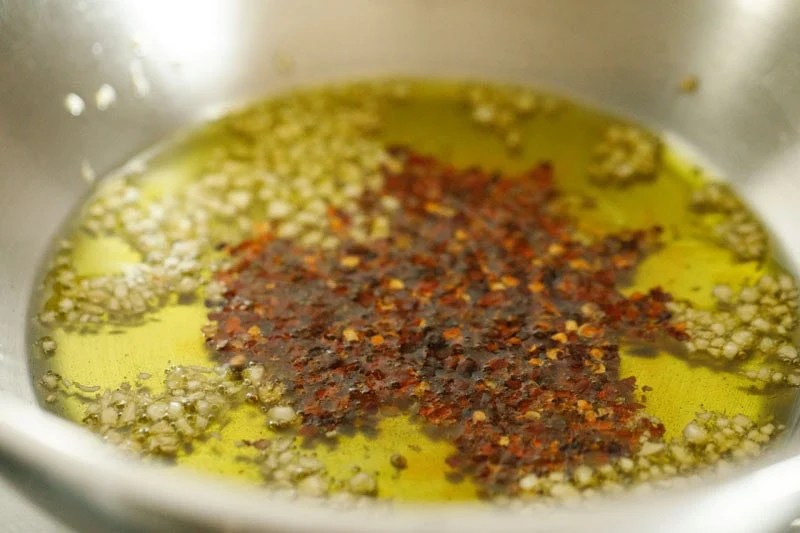 Olive oil with garlic and red pepper flakes.