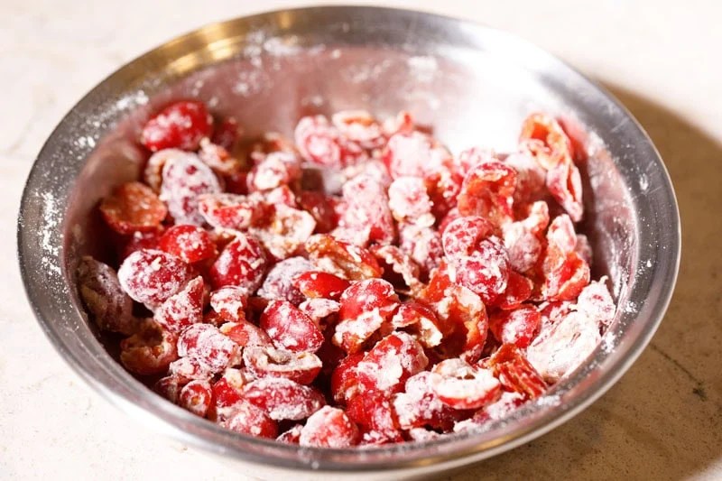 Flour mixed with red cherries.