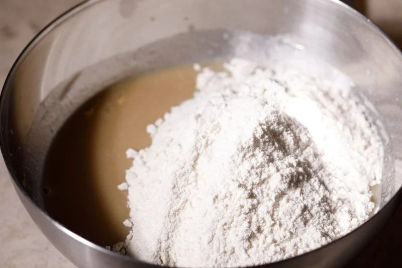 Sifted flour added to buttermilk mixture.