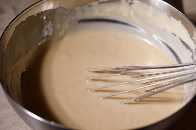 Whisk in bowl with prepared cake batter.