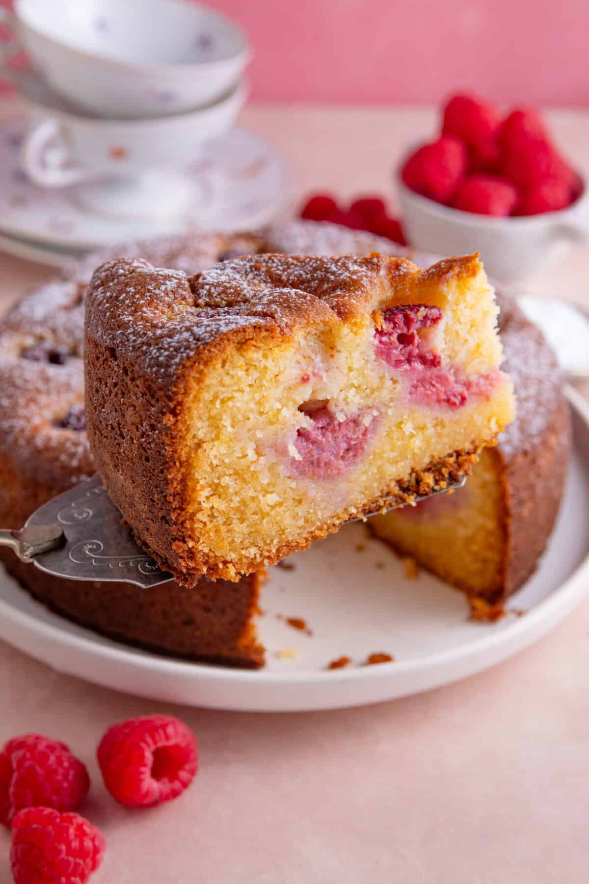 A slice of gluten free raspberry and ricotta cake.