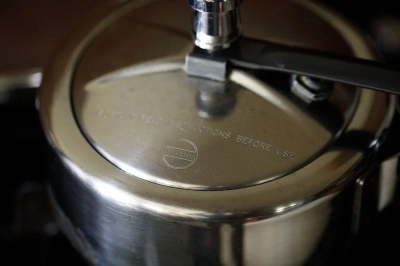 Pressure cooker closed with lid.