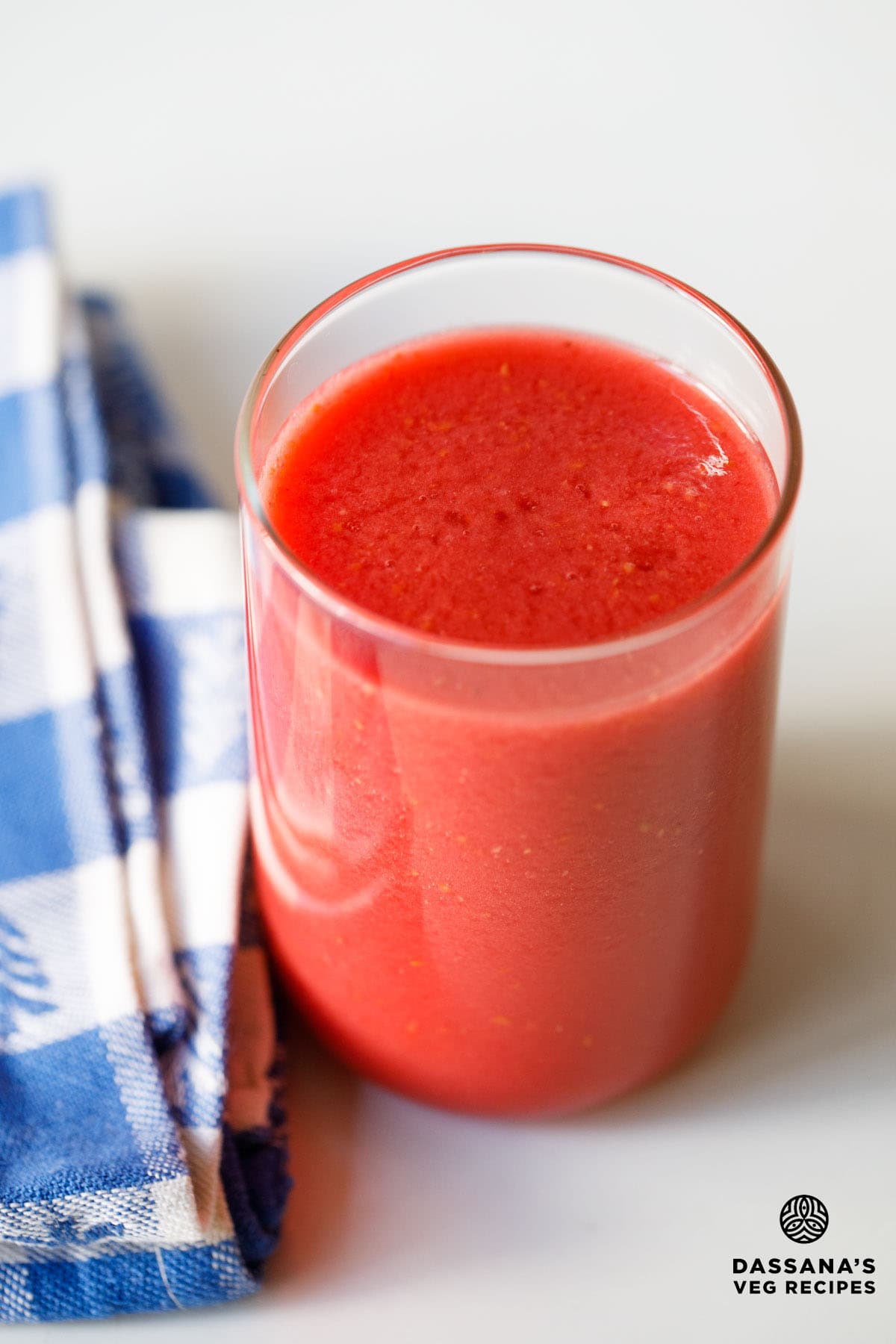 Red raspberry juice in a glass.