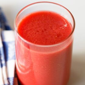 Fresh raspberry juice in a glass.