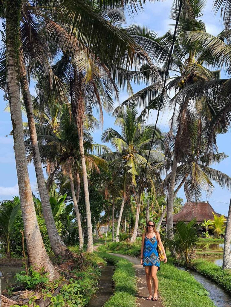 anna walking through rice fields in ubud bali