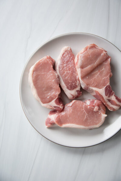 boneless pork loin chops on a plate