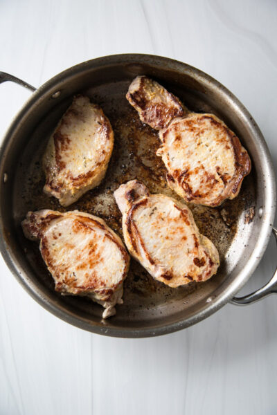 seared boneless pork loin chops in a skillet