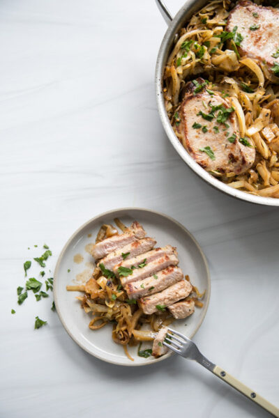 seared boneless pork loin chops and cabbage on a plate