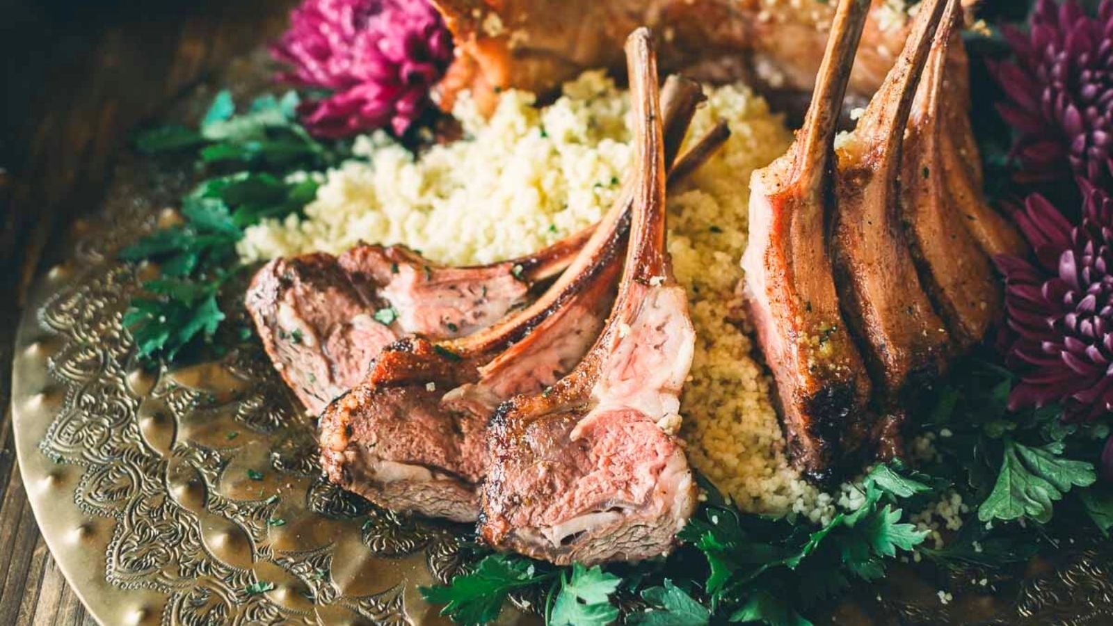 Grilled lamb crown roast with Moroccan spices and charred exterior served whole.