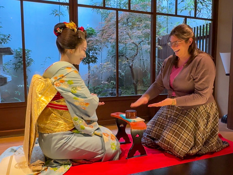 Amanda playing a game with a maiko