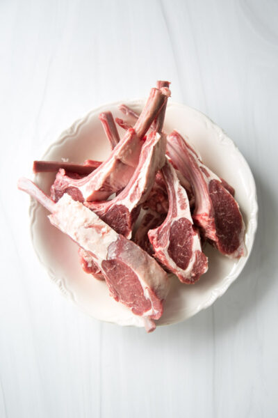 raw lamb rib chops in a bowl