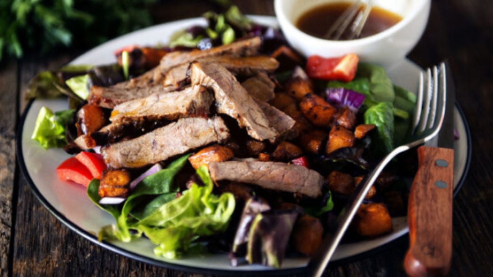 Strip steak salad with sweet potatoes and chile lime dressing.