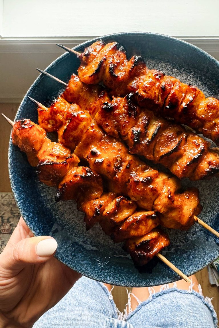 Chicken skewers on a plate.
