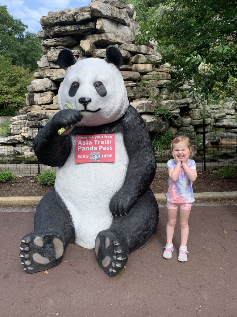 Washington DC Field Trips an image of a student next to a panda statue at the National Zoo