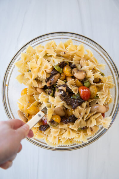 gluten-free farfalle in a bowl with pasta salad ingredients 