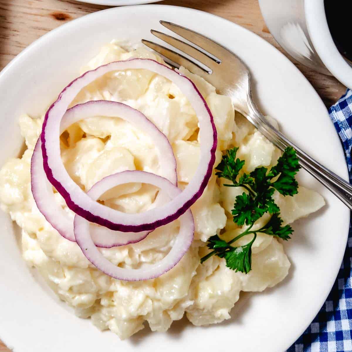 white potato salad with mayo and onions.