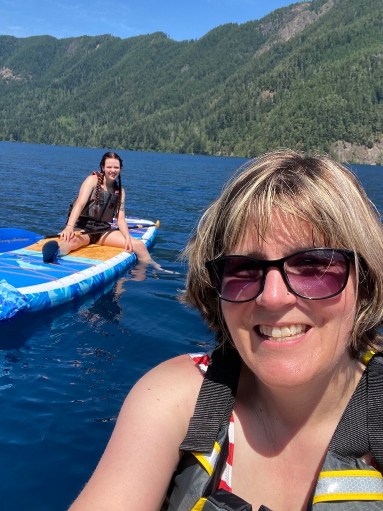 Author Karen Barnett and daughter on paddleboards.