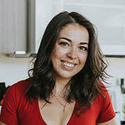 Rachel Connors headshot in a red shirt.