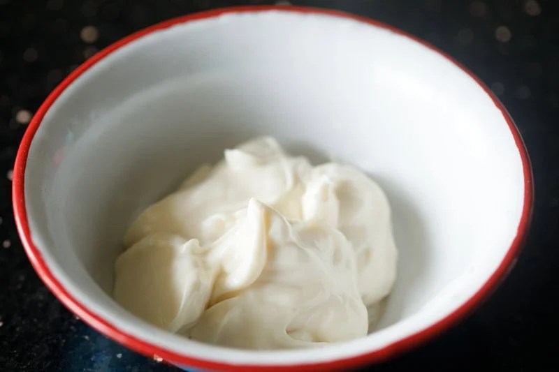Mayonnaise in a white bowl.