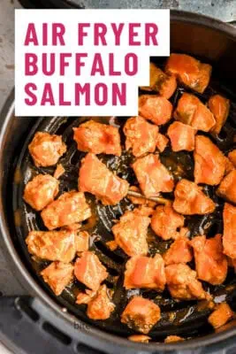 buffalo salmon in air fryer basket.