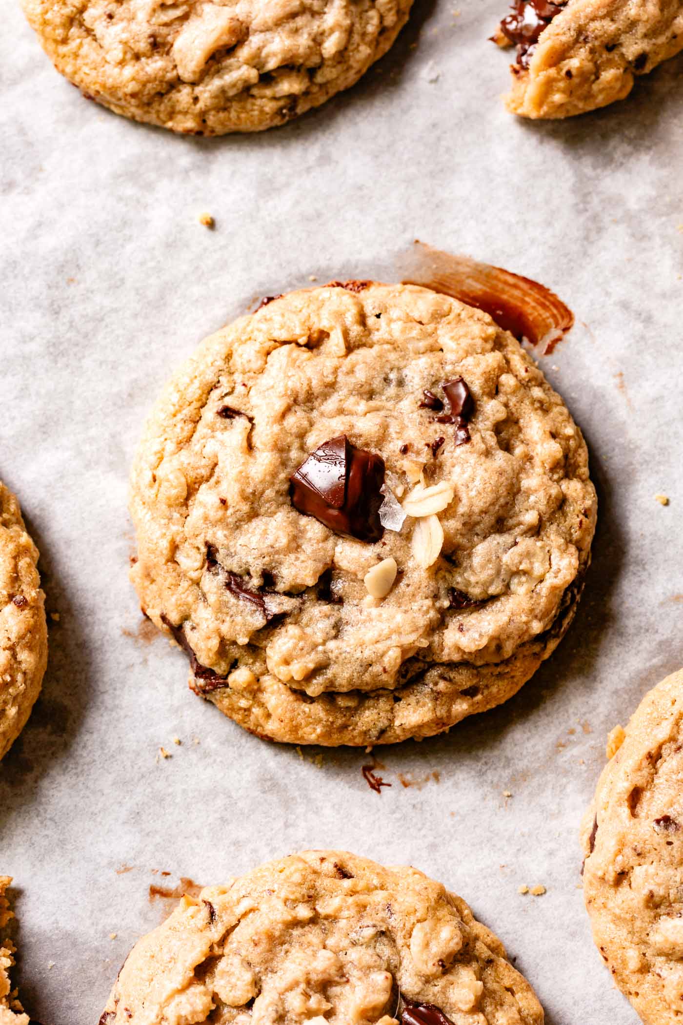 baked cookies on a messy piece of parchment paper