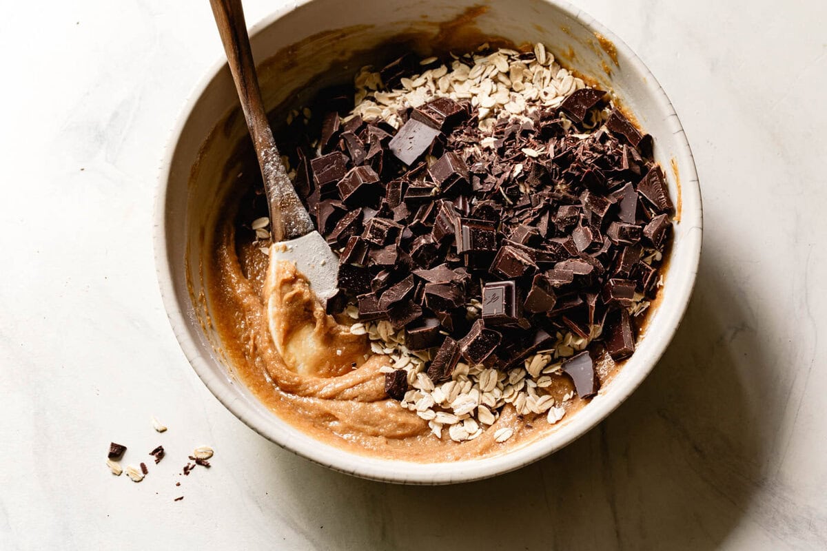 adding in chopped chocolate and rolled oats