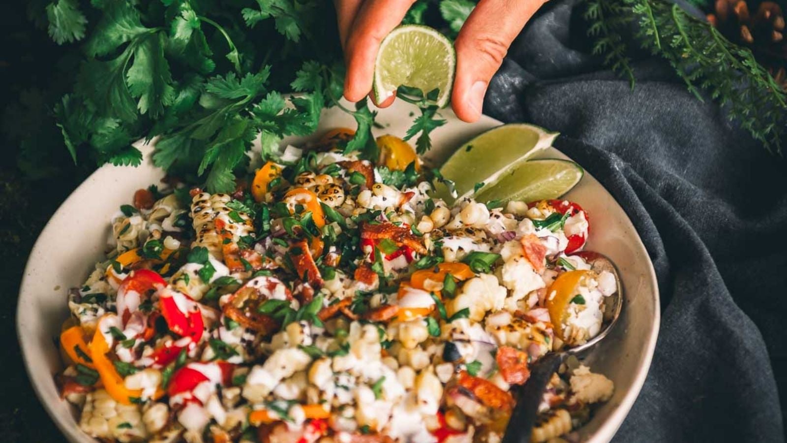 Grilled corn salad with charred kernels tossed with herbs and bright dressing.