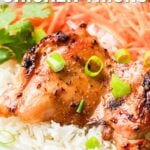 Close-up of glazed chicken thighs on white rice, garnished with sliced green onions, with sliced vegetables in the background. Text overlay reads "How to Make Lemongrass Chicken Thighs.
