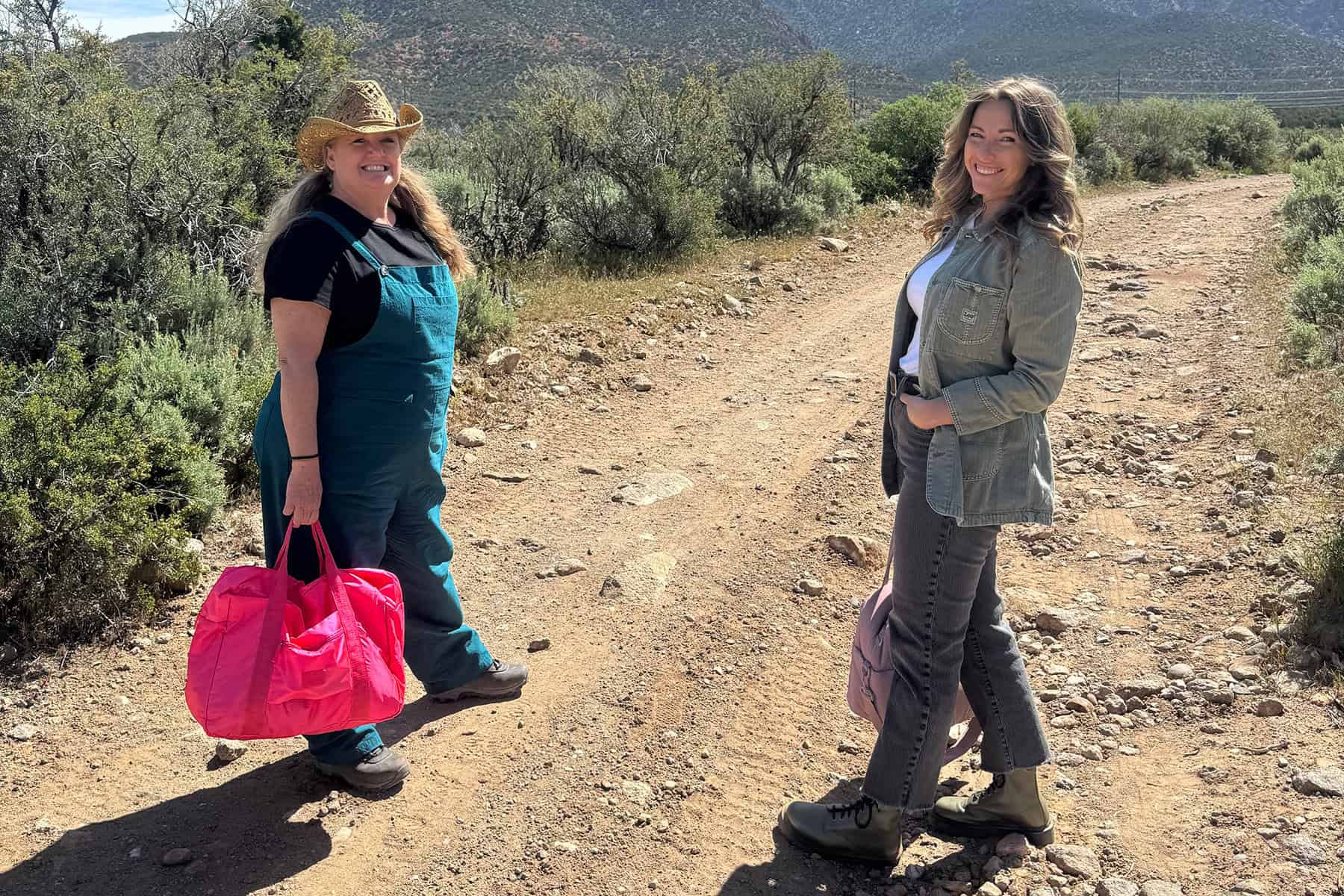 Christie and Susie walk on a trail. 