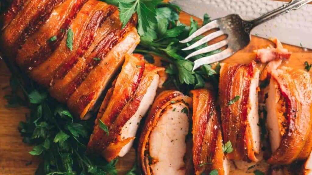 Sliced bacon wrapped pork loin.