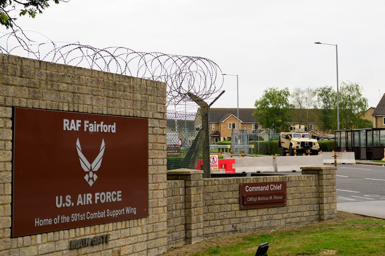 The entrance to a military base is shown with a brick structure.