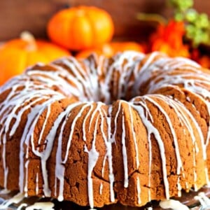 gluten-free pumpkin bundt cake with pumpkins in the background